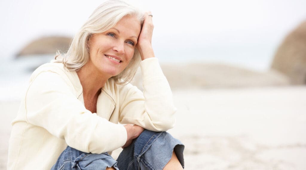 skaneateles laser treatment model resting on beach
